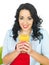 Healthy Young Woman Drinking Large Glass of Fresh Orange Juice