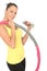 Healthy Young Woman Holding a Dumb Bell and Hula Hoop
