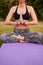 Healthy young woman practicing yoga in park