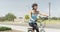 Healthy young woman riding bike