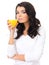 Healthy young woman sipping fresh orange juice