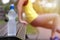 Healthy young woman stretching before fitness and exercise in park, water bottle in focus. Healthy lifestyle concept