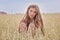 Healthy young woman in summer wheat field