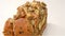 Healthy and yummy bread with walnut raisin and melon seed rotating on white