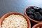 Healty, vegetarian dried fruit breakfast. Set of bowls with dried fruit to enrich a healthy vegan breakfast. Oats, almonds and