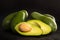 Heap of avocados on wooden table