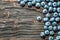 Heap of bilberries on vintage wooden background