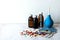 Heap of blisters of colorful pills and medical bottles on a white background.