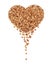 Heap of buckwheat kernels in the form of a heart
