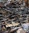 Heap of burned and scattered bricks beams and rubble after a fire in a large building