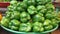 A heap of capsicums in green pot