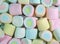 Heap of Closed up Pastel Pink, Yellow, Blue Colored Marshmallows for Background