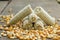 heap of cob and kernels corn on wood