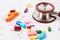 Heap of color pills and tablets with stethoscope medical.