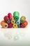 Heap colored industrial spools arranged on white background