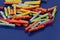 A heap of colorful tombola tickets are lying on a blue ground