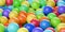 Heap of colourful spectrum or rainbow colored spheres or balls, color, education or playing concept background, selective focus