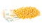 Heap of corn or maize kernels with euro banknotes over white background - corn cost or prize concept