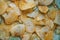 Heap of Crispy Potato Corrugated Chips. Food. Fatty Unhealthy Fast Food