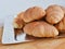 Heap of croissants on a metal tray close-up.