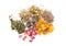 Heap of different aromatic dried herbs and flowers on white background