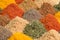 Heap different Asian Spices lies on wooden background. Spice and seasoning. Various fragrant spice market. Assortment