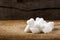 Heap of different sugar cubes shapes on wood