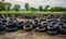 A Heap of Discarded Tires Amidst a Dusty Landscape