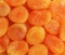 Heap of dried apricots close-up background