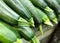 Heap of early dark green vegetable marrows Zucchini