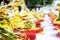 Heap of fragrant flowers with incense on red wooden trays