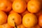 Heap of fresh juicy tangerines as background, top view