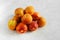 Heap of fresh ripe apricots on a table made of natural marble, copy space. Apricots are rich in vitamins and minerals such as: