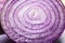 A heap of fresh sliced red onion rings. Image on