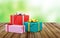 Heap of Gift Boxes on a Colorful Packages on Vintage Wooden Table with Blurred Backgound Behind