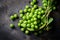 Heap green peas on dark stone background. Generative AI