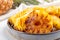 Heap of grilled pineapple slices on gray plate on concrete background