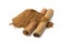 Heap of ground cinnamon and cassia cinnamon sticks