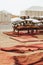 Heap of many different pillows and red rug carpets in glamping camp Morocco