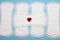 Heap of menstruation sanitary cotton soft pads for woman hygiene protection. Woman critical days, gynecological menstruation cycle