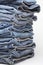 Heap of modern designer blue jeans