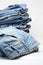 Heap of modern designer blue jeans