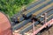 Heap pile heavy raw rusted steel iron beam girders loaded on railroad cargo freight carriage. Metal goods factory plant