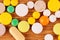 Heap of pills on wooden desk