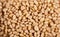 Heap pine nuts on wooden board