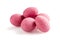 Heap of pink sugared almonds dragees isolated on white background