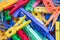 Heap of plastic laundry clothespin in vivid colors