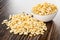 Heap of puffed rice, rice in bowl on wooden table