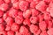 Heap of raspberries in box