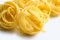 Heap of raw dry nest pasta